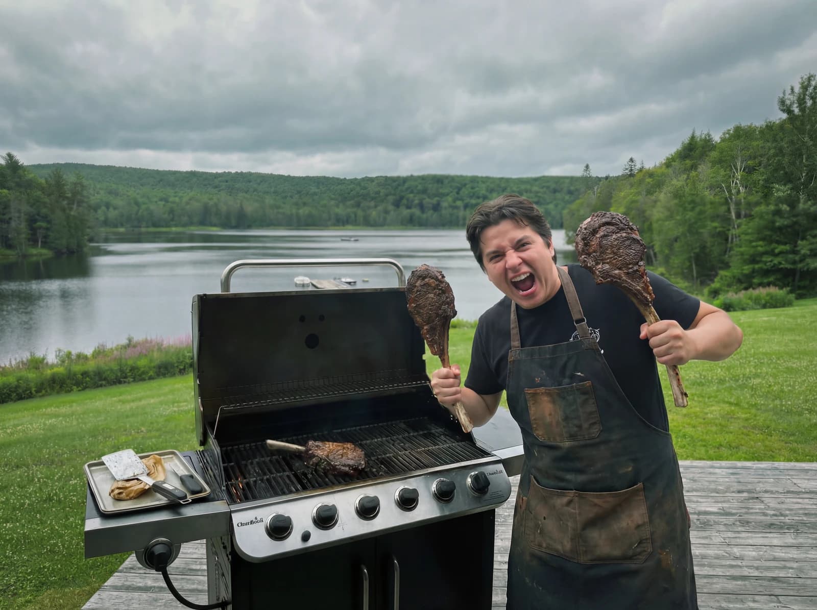 Outdoor BBQ grilling on the deck with lake view