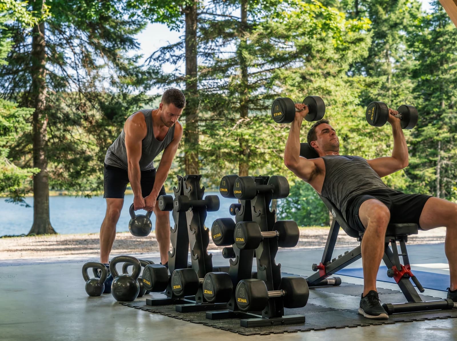 Outdoor gym with free weights and lake backdrop