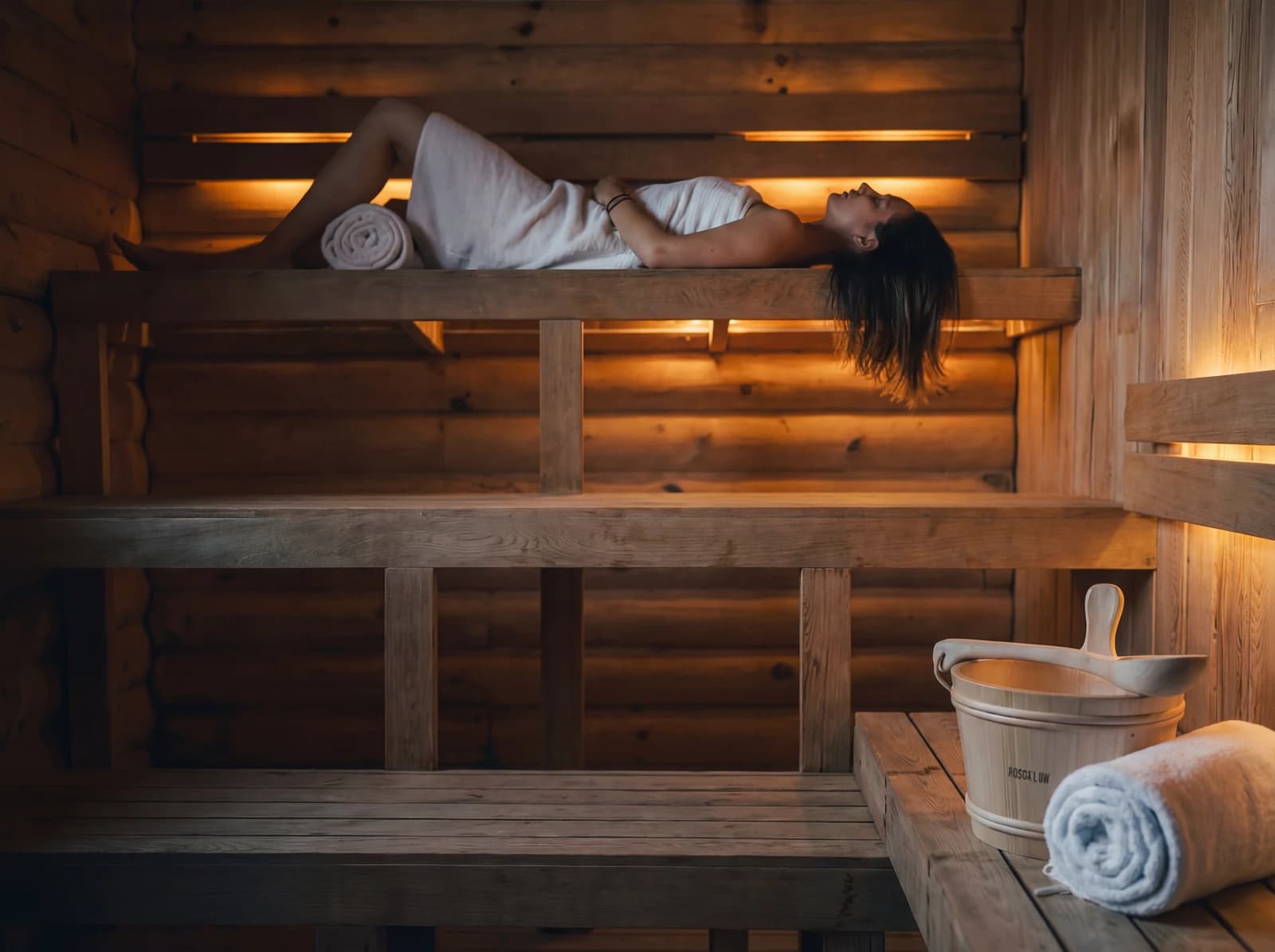 Woman relaxing in the cedar sauna
