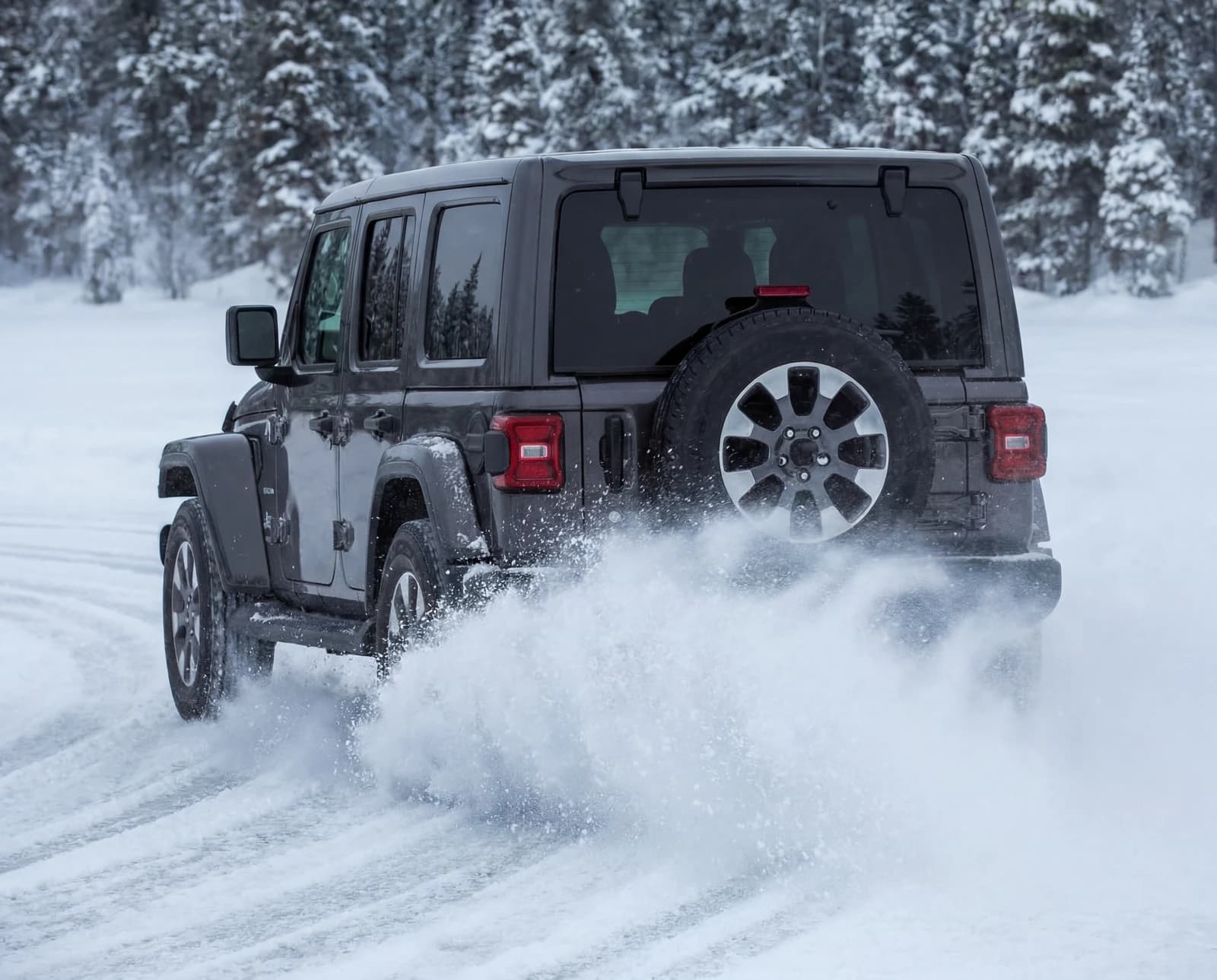 Four-by-four driving through fresh snow