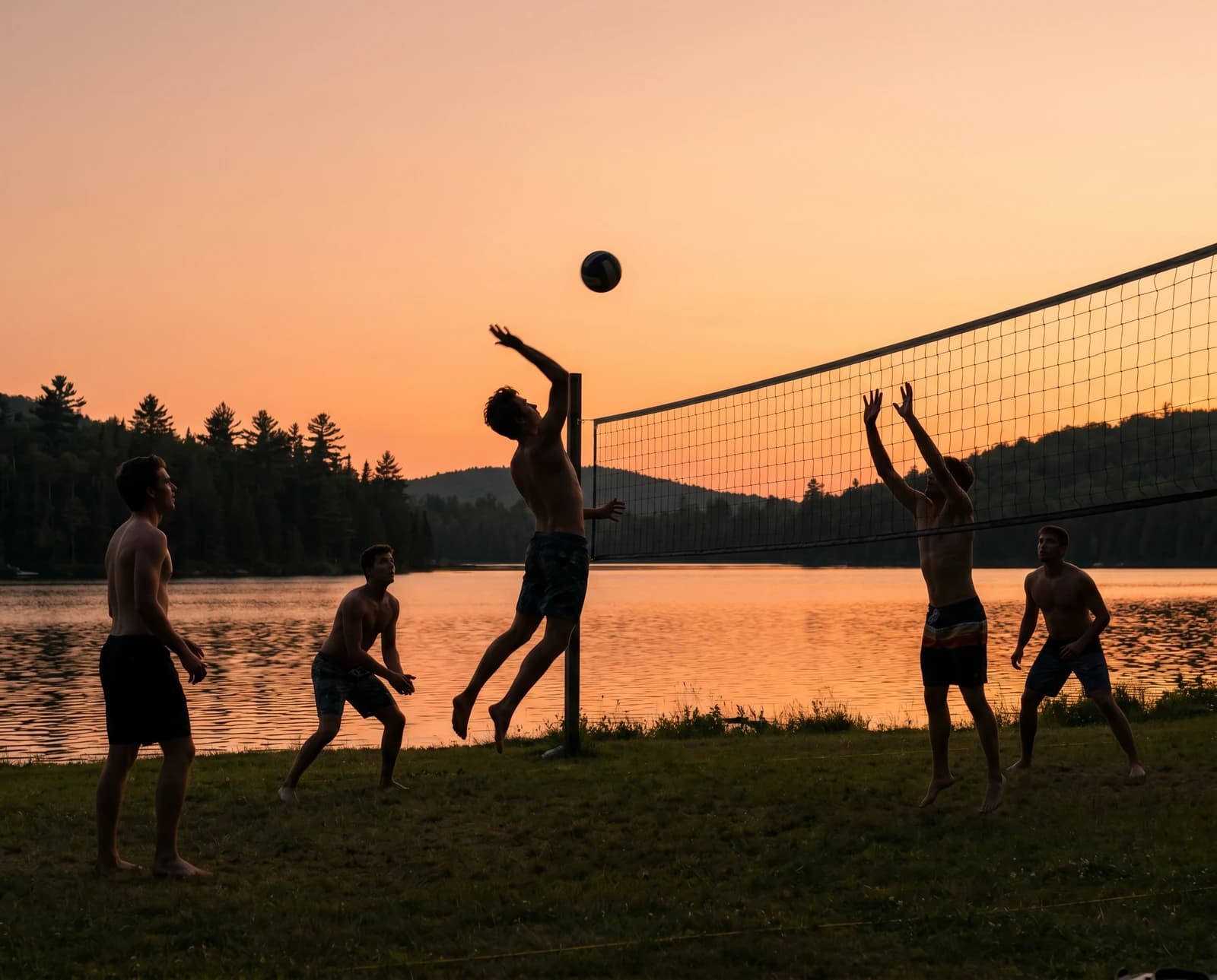 Beach volleyball by the lake at sunset